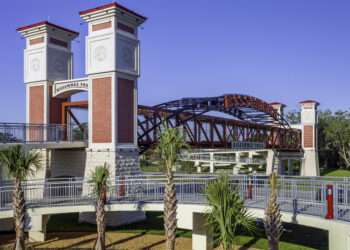 This modern pedestrian crossing above a major local highway is part of Kissimmee's Parks and Recreation trails projects and is also part of Florida's coast to coast public trails system.