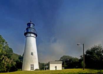 The Amelia Island Light is a lighthouse located on the north end of Amelia Island at the mouth of the St. Mary's River. It was built in 1838 using materials taken from the former Cumberland Island lighthouse in Georgia. The Cumberland Island lighthouse had been built in 1820. The lighthouse marks the entrance to Nassau Sound and the harbor for Fernandina Beach, Florida