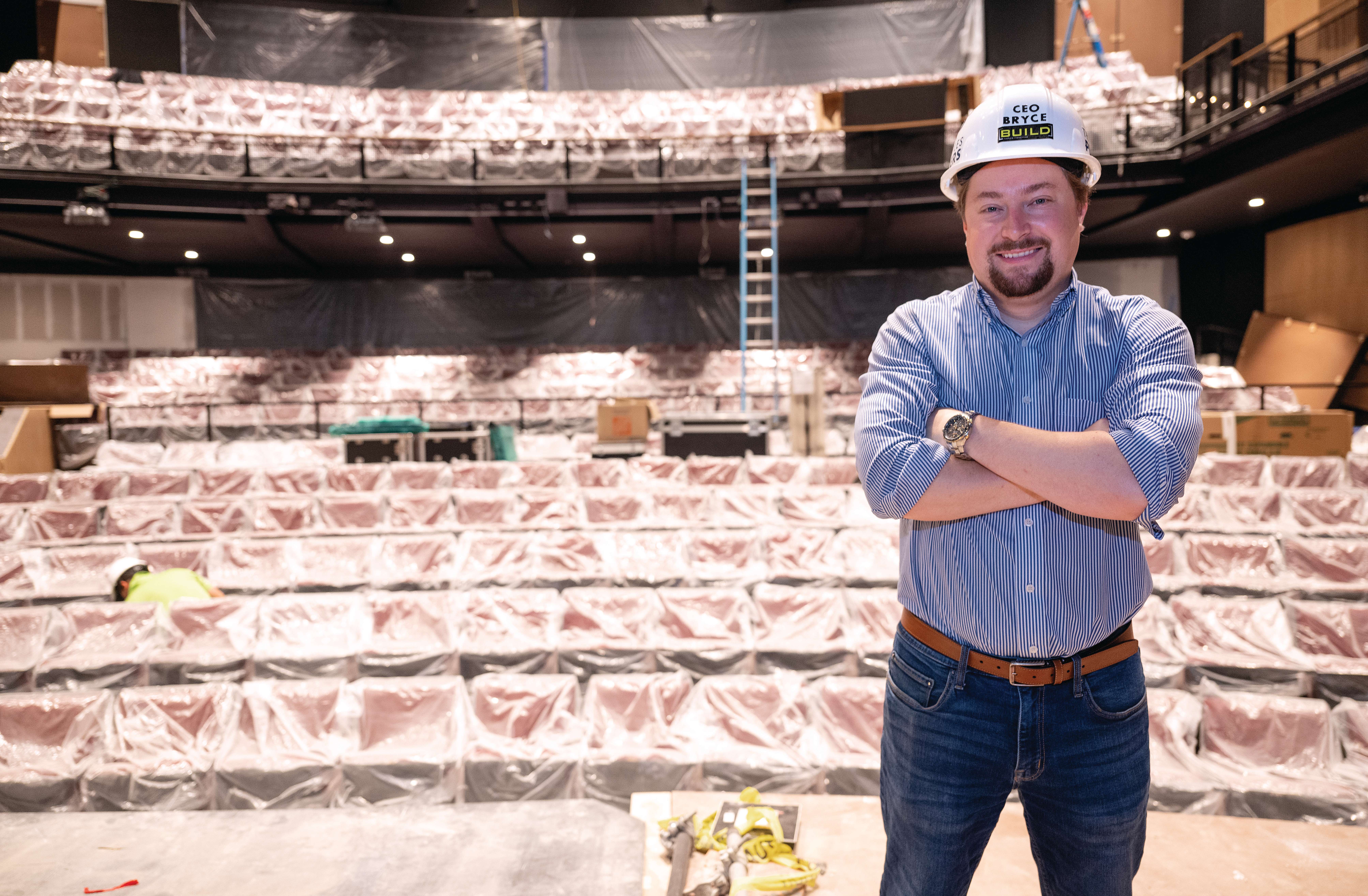 Bryce Alexander, executive and artistic director stands center stage in the newly renovated Sugden Theatre on 5th Street in downtown May 13, 2024 in Naples.