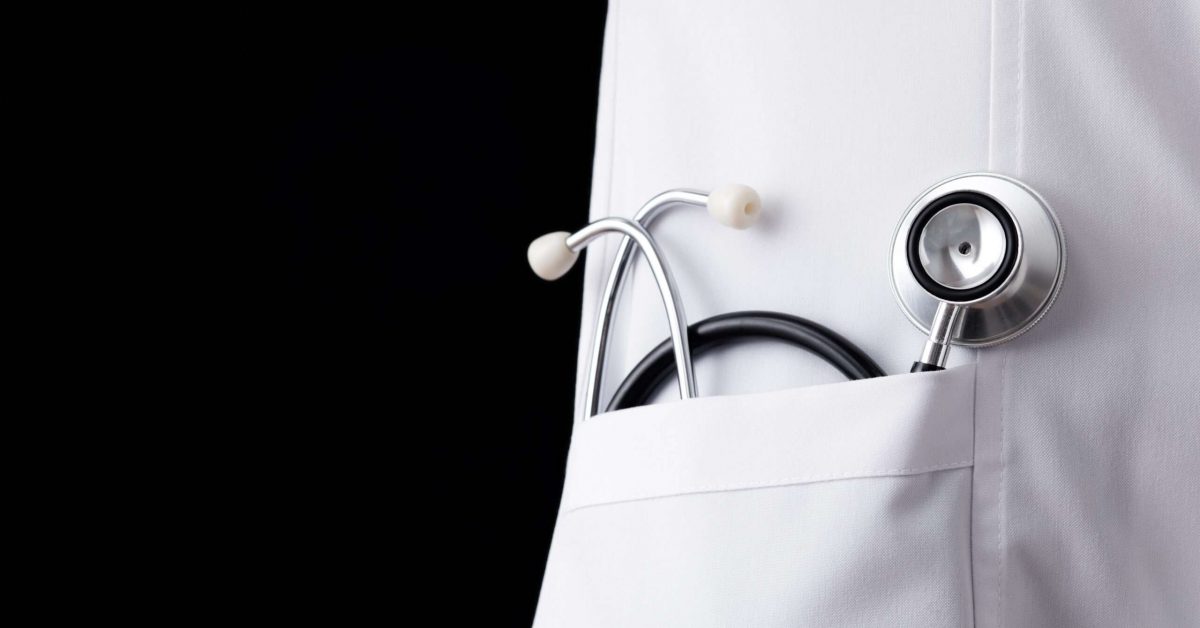 Stethoscope in lab coat pocket