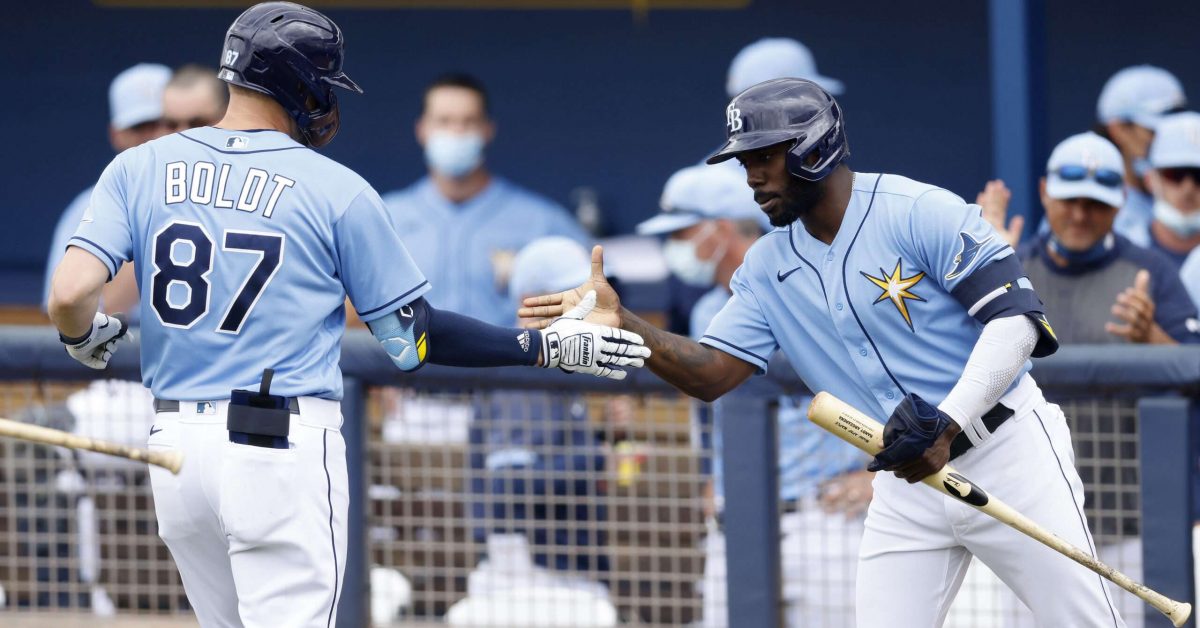 PORT CHARLOTTE, FLORIDA - MARCH 21: Ryan Boldt #87 of the Tampa Bay Rays celebrates with Randy Arozarena #56 after hitting a solo home run against the Atlanta Braves during the third inning of a Grapefruit League spring training game at Charlotte Sports Park on March 21, 2021 in Port Charlotte, Florida. (Photo by Michael Reaves/Getty Images)