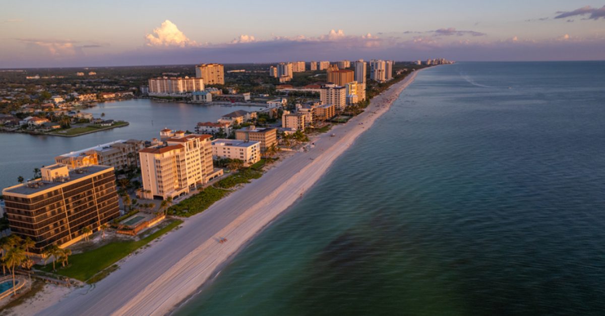 Aerial drone photo Naples Vanderbilt Beach Florida at sunset