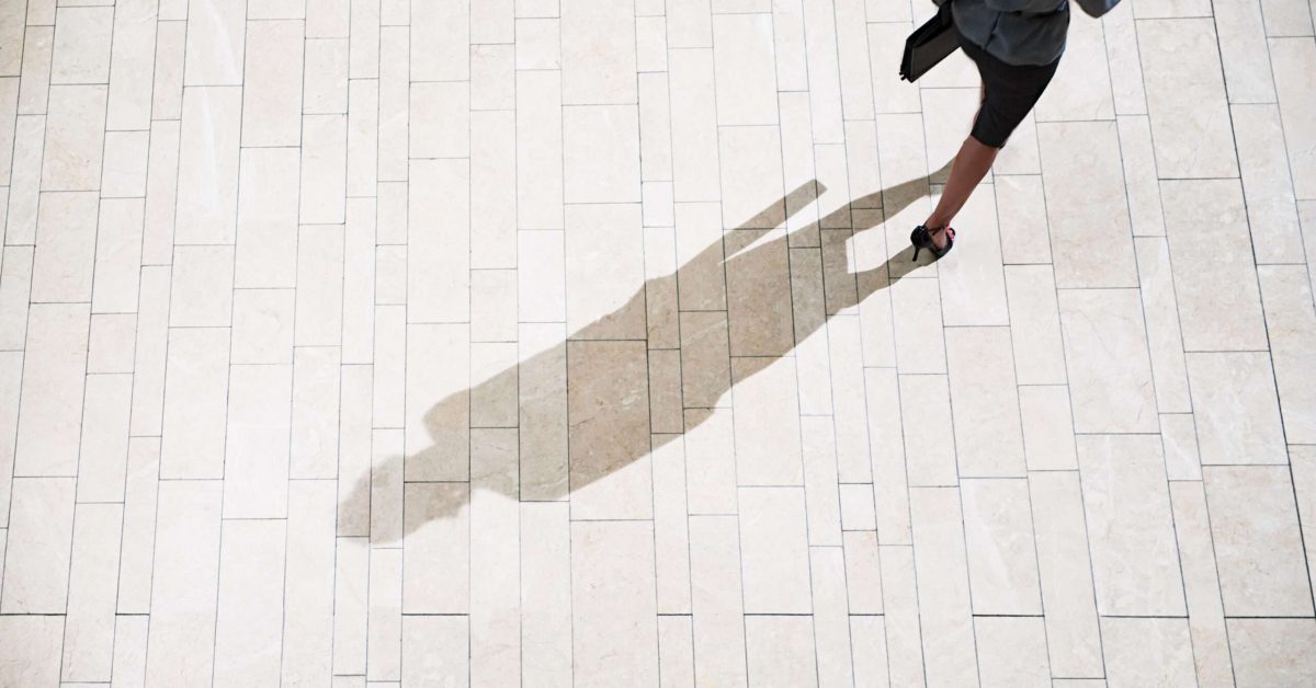 Businesswoman running in lobby