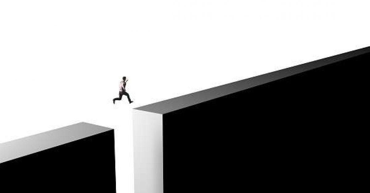 Businessman jumping from obstacles of life